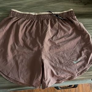 Pink Nike running shorts